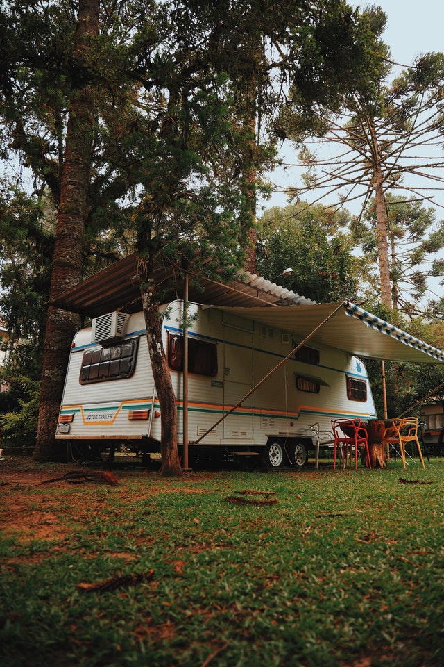 RV parked under a tree